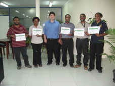 Picture of Greg with the first class in Papua New Guinea